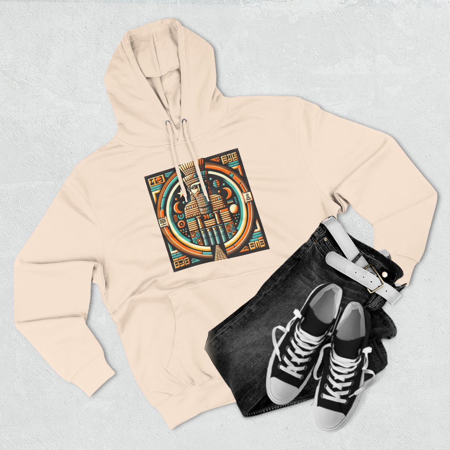 Pale pink hoodie paired with shoes and jeans with graphic of Anu (An), the Mesopotamian sky god and father of deities like Enki, Enlil, and Inanna.