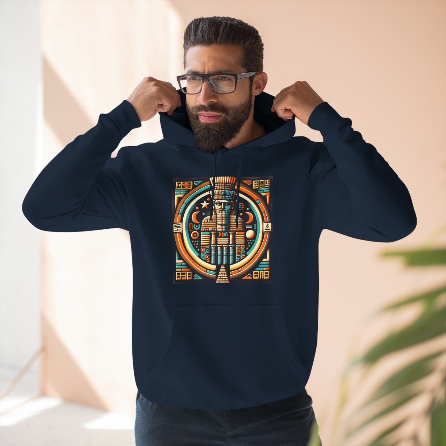 Man wearing navy hoodie with graphic of Anu (An), the Mesopotamian sky god and father of deities like Enki, Enlil, and Inanna.